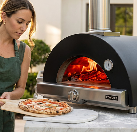 pizza oven for an outdoor kitchen featuring a Coyote pizza oven