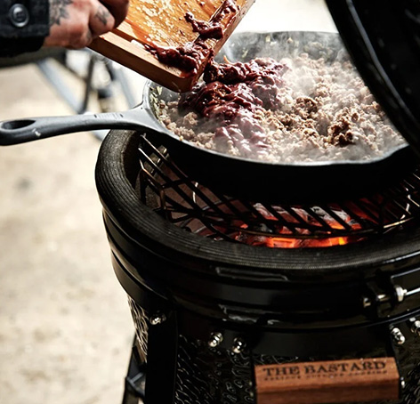 smoking meat on a smoker in an outdoor kitchen