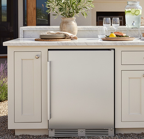 outdoor refrigerator built-into an outdoor kitchen island
