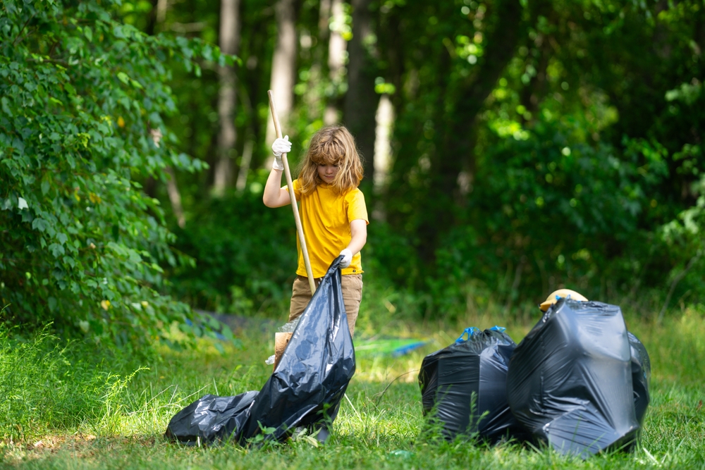 Global,Environmental,Pollution.,Child,Collects,Plastic,Trash,Outdoor.,The,Concept